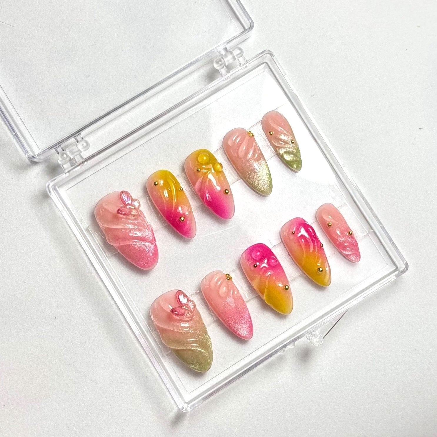 press on nails faits main réutilisables cat eyes rose vert et rose jaune papillon rose féérique 